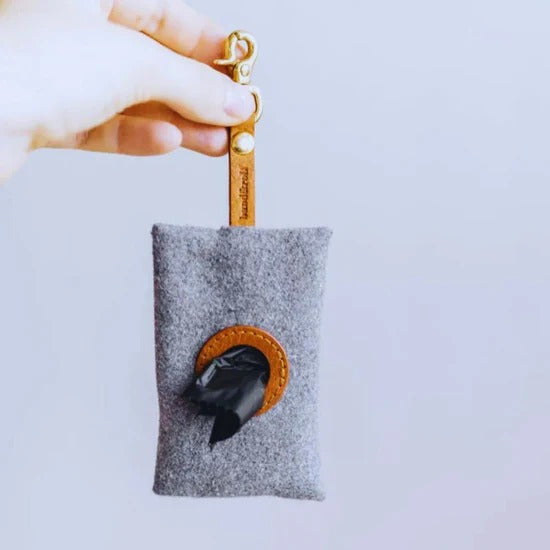 Felt dispenser for dog waste bags